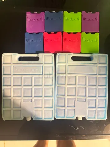 Set of reusable gel ice packs and cube chillers for coolers