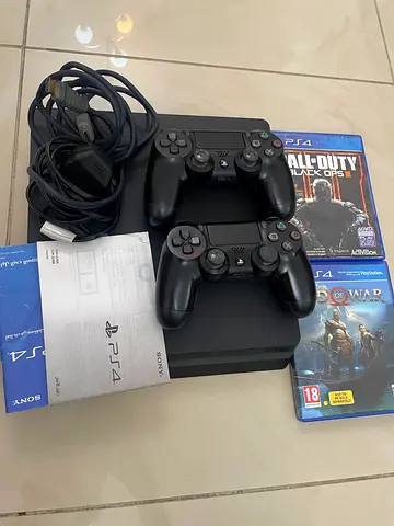 PS4 Slim 500gb  with 2 DualShock Controllers, Cables and 2 Games