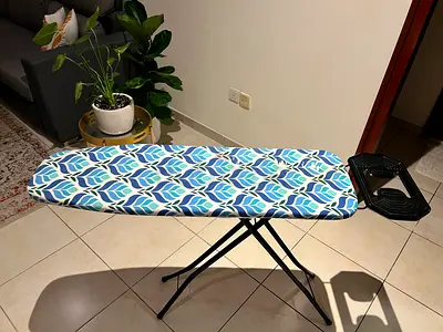 Sturdy ironing board with built-in iron rest - good condition