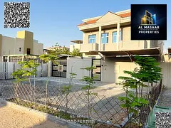 Luxury villa with three bedrooms, living room, kitchen, maid's room and outdoor seating area for