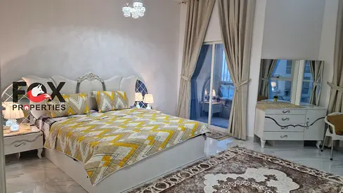 Two rooms and a living room for annual rent in Al Khor Towers in Al Rashidiya 1 area fully furnished with a balcony sea view and the latest decoration