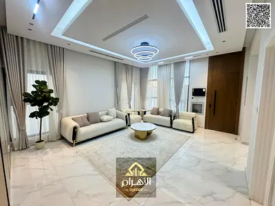 Villa for sale next to the mosque and near Sheikh Mohammed Bin Zayed Road, excellent finishing at an attractive price including registration fees and