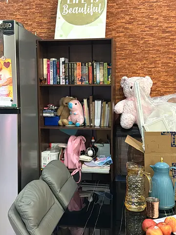 Assorted used fiction and childrens books on shelf - mixed collection
