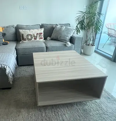 Light coloured wooden coffee table