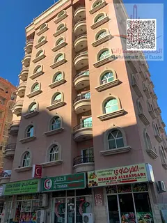 Studio apartment for annual rent in Ajman, Al Rashidiya 3, opposite Grand Mall, with a separate kitc