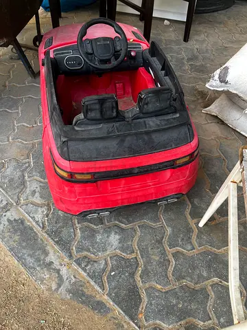 Red 2-seater Electric Ride-On Car for Kids (used)