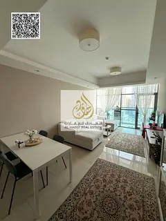 One-bedroom apartment for sale in Gulf Towers on Sheikh Khalifa Street, with a stunning view.
