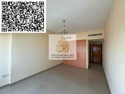 For annual rent in Ajman, Al Rashidiya 3, next to Grand Mall Ajman. Two bedrooms, living room, and three bathrooms. Free air conditioning with built-i