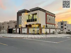 Corner villa, two floors and a roof, in one of the most prestigious areas of Ajman, on a main street