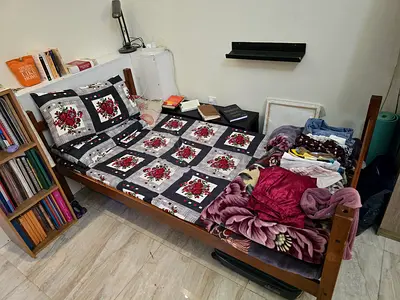 Single wooden bed with mattress