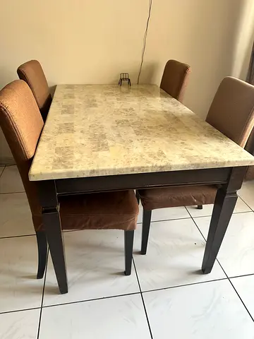 Sturdy Dining Table with Chic Marble Top from homes R US with 4 chairs from ikea