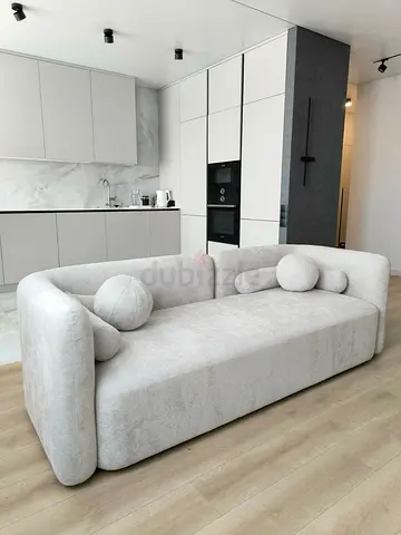 Modern light grey 3-seater sofa with rounded arms