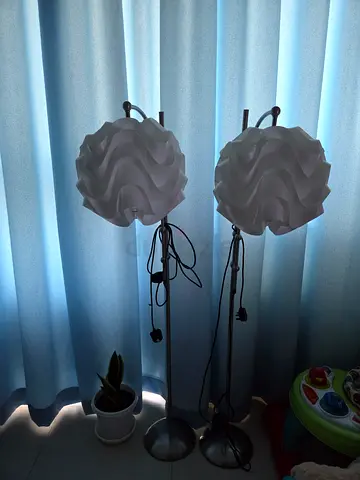 Pair of modern white sculpted floor lamps — good condition
