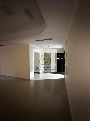 A one-bedroom apartment with a living hall is available for annual rent in Al Rashidiya 1, ideally located opposite Nesto Hypermarket and close to all