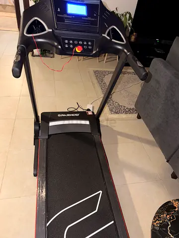 Used folding electric treadmill with display and handrails - excellent condition