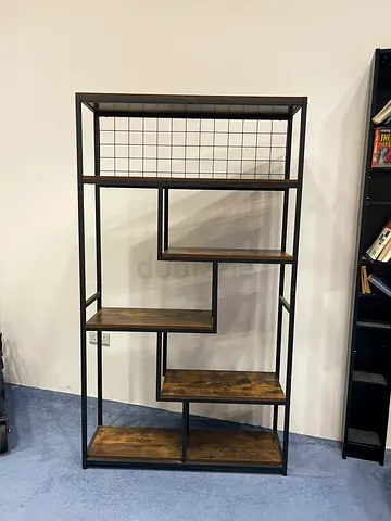 Industrial-style open shelving unit with wooden shelves