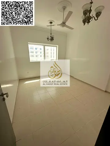 For annual rent in Ajman - Directly on Al Ittihad Street - Two-bedroom apartment with a living room and two bathrooms - Price: 37,000 AED - Flexible p