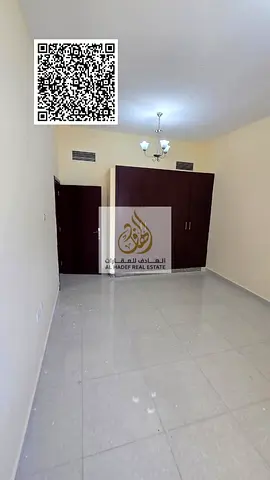 Two-bedroom apartment with a living room for annual rent, with built-in wardrobes, in Al Nuaimiya 1