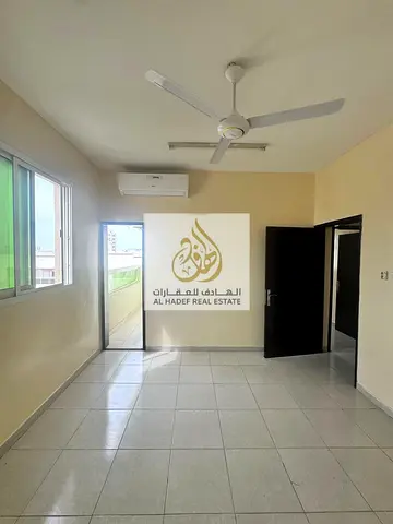 Two bedrooms, a large living room with a balcony, and two bathrooms in Al Rawda 1, Ajman.