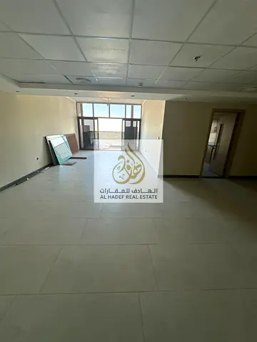 Annual rent in Ajman, Al Bustan area, near Ajman Museum. The building is suitable for families. Apartment with three bedrooms, a living room, a maid's