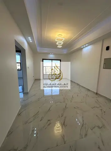 Annual rent in Ajman, Al Muwaihat 3, near Saudi German Hospital. New building, suitable for families. Apartment: 1 bedroom, living room, balcony, cent