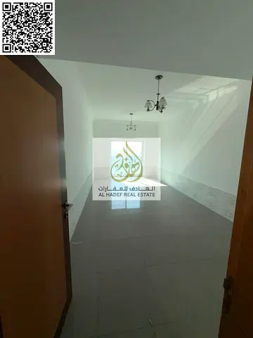 Two bedrooms and a living room, two bathrooms, master bedroom with balcony, near Ajman Court