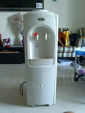Light Used Freestanding Water Dispenser - Hot  Cold Nestle Brand.