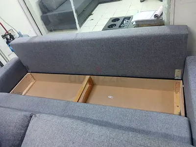 Grey fabric storage sofa bed — good condition