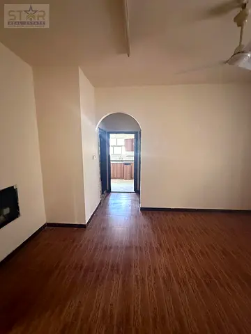 One-bedroom apartment with a living room for annual rent in Rashidiya 1