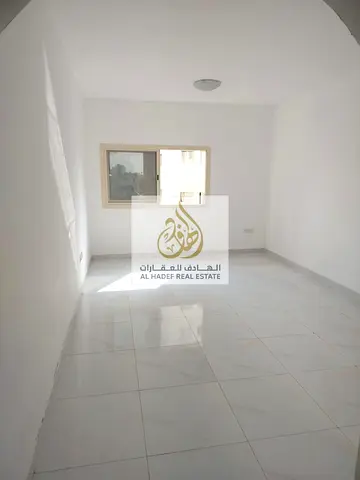 Annual rent in Ajman, Al Nuaimiya 2 area, next to Istanbul Market, Lulu Gulf, and Al Safar Mall. One bedroom and separate living room, central air con