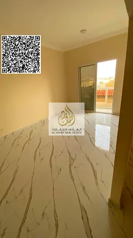 Two bedrooms, a living room, three bathrooms, a balcony, and a separate lounge. Second tenant. Excellent finishing. Located in Al Muwaihat 3, near Ajm