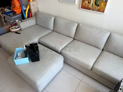 Light grey sectional sofa with ottoman - 4-seater