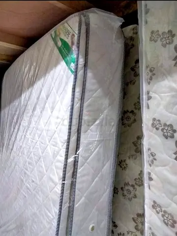 Almost-new double mattress with protector cover included
