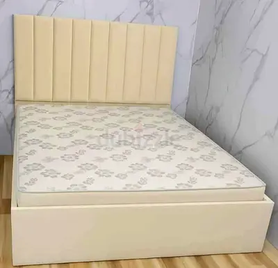 Cream upholstered platform bed with mattress - good condition
