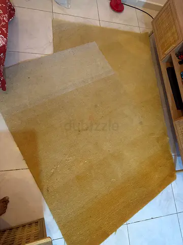 Used mustard yellow area rug - medium size