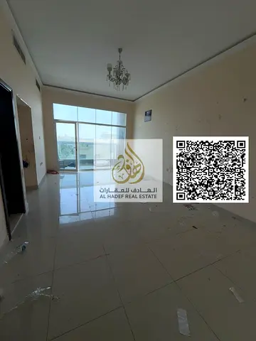 One-bedroom apartment for rent in Al Rawda 3, Ajman, with two bathrooms, a balcony, very spacious areas, excellent finishing, close to Sheikh Ammar St