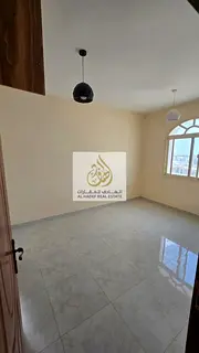 For rent in Ajman Al Jurf 2, 1-bedroom apartment with 2 bathrooms, balcony with open view, built-in