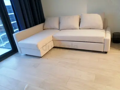 Light beige 2 seater sofa bed L-shaped fabric sofa with chaise - good condition