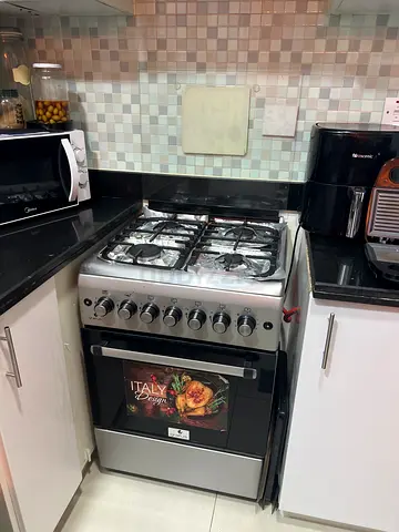 Used freestanding gas oven and cooker - 4 burners, stainless steel
