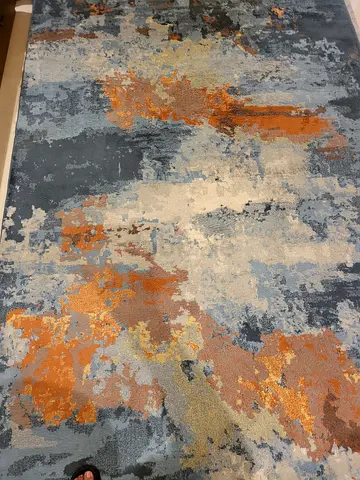 Modern abstract area rug - blue, grey and rust tones