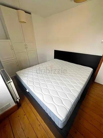 Ikea King Black Malm bed frame with Ikea King mattress