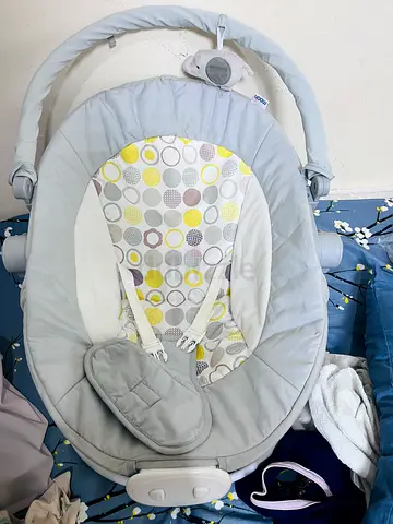 Light grey baby rocker/soothing bouncer with music - gently used