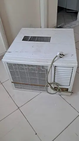 Used Window Air Conditioner Unit - Compact, Needs Cleaning