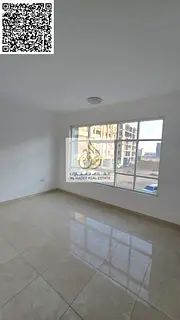 One-bedroom apartment with a living room, two bathrooms, and a balcony. Second tenant in Ajman. For