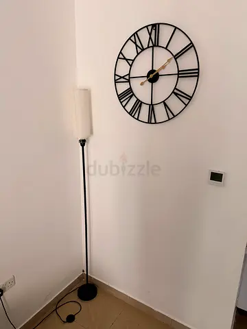 Slim black floor lamp with fabric shade