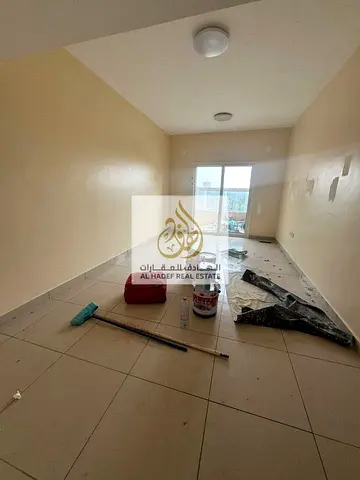 Two bedrooms and a living room for annual rent with built-in wardrobes, central gas, and parking inside the tower.