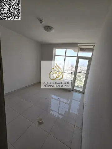 Two bedrooms and a living room with a balcony, two bathrooms, and a built-in wardrobe. Located directly on Khalifa Street, near Verona Roundabout.
