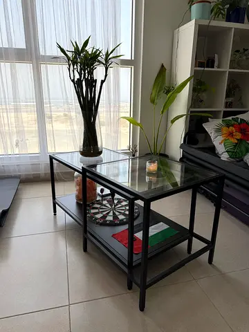Glass Top Coffee Table with Black Metal Frame — Good Condition.