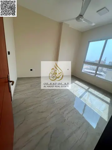 For annual rent in Ajman, Al Jurf 3 area: a distinctive apartment, first occupancy, with a very spacious design. It consists of two rooms, a living ro