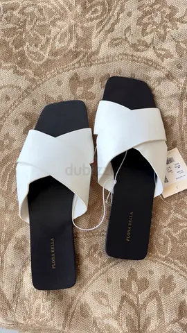White cross-strap flat slides